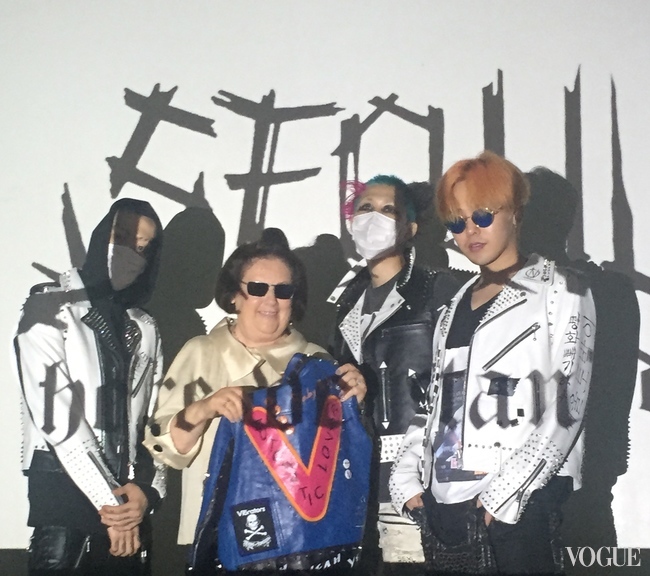 G Dragon, the orange-haired K-Pop star, poses with Suzy, together with pink’n’aqua-haired artist, 99percentis, and a ‘hooded’ Boon the Shop’s Creative Director Xin Yang  Credit Suzy Menkes Instagram  