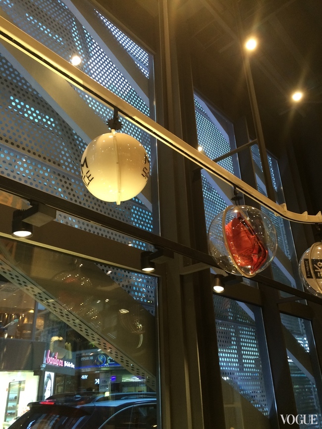 MCM's bags displayed in Perspex globes