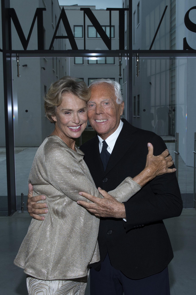 Lauren Hutton and Giorgio Armani pose in the doorway of his Silos