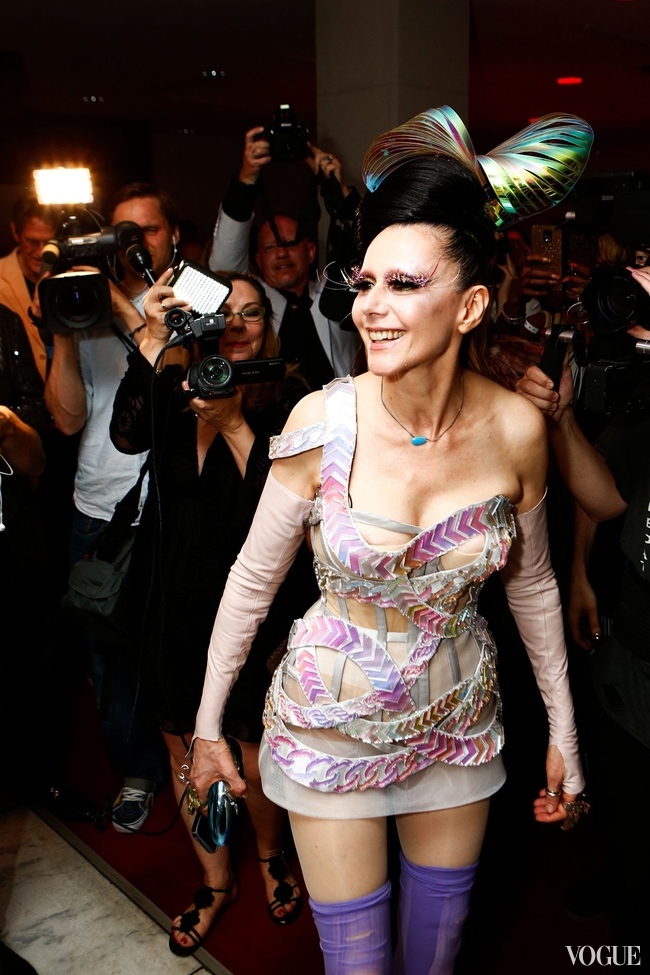 Susanne Bartsch posing for the paparazzi at the party for her exhibition at FIT last night