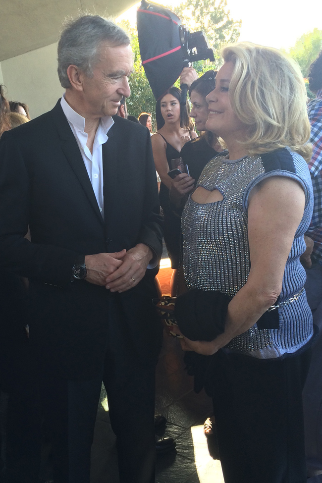 Bernard Arnault, chairman and CEO of LVMH, catches up with Catherine Deneuve